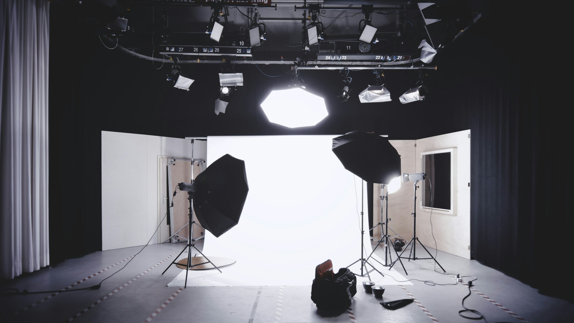 Photo studio with strobes and softboxes set up for a portrait session