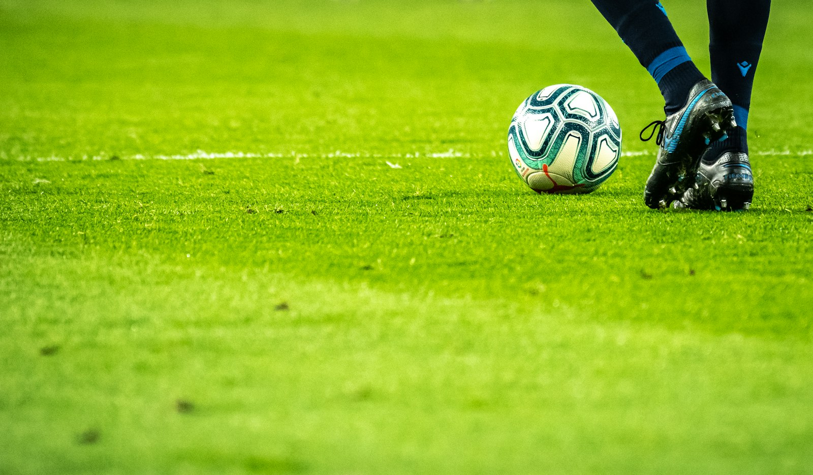 Soccer ball centered in an empty stadium before kickoff